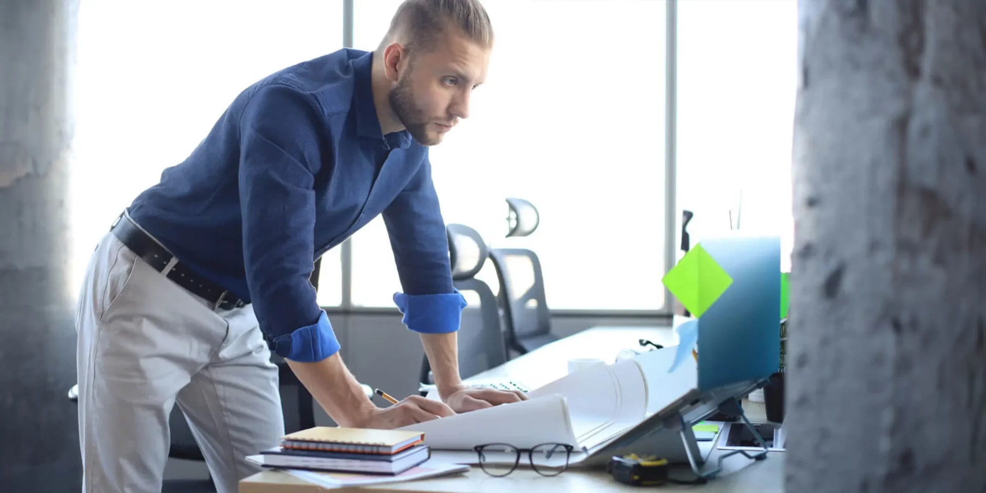 A project management professional reviewing and preparing estimating reports.