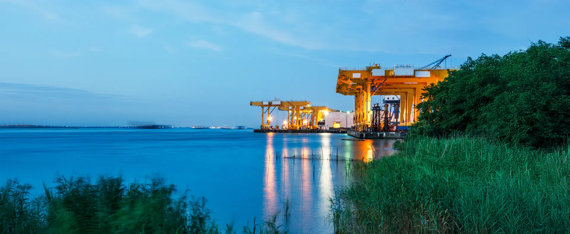 An illuminated offshore industrial platform with loading equipment