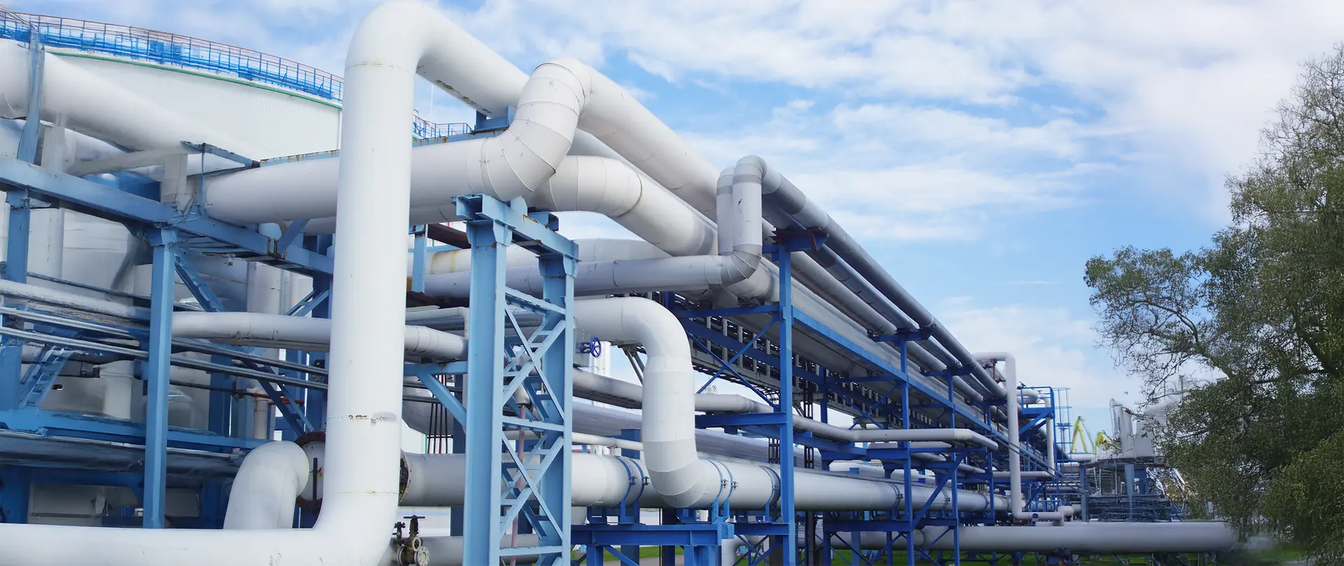 white and blue pipes in an oil and gas project site