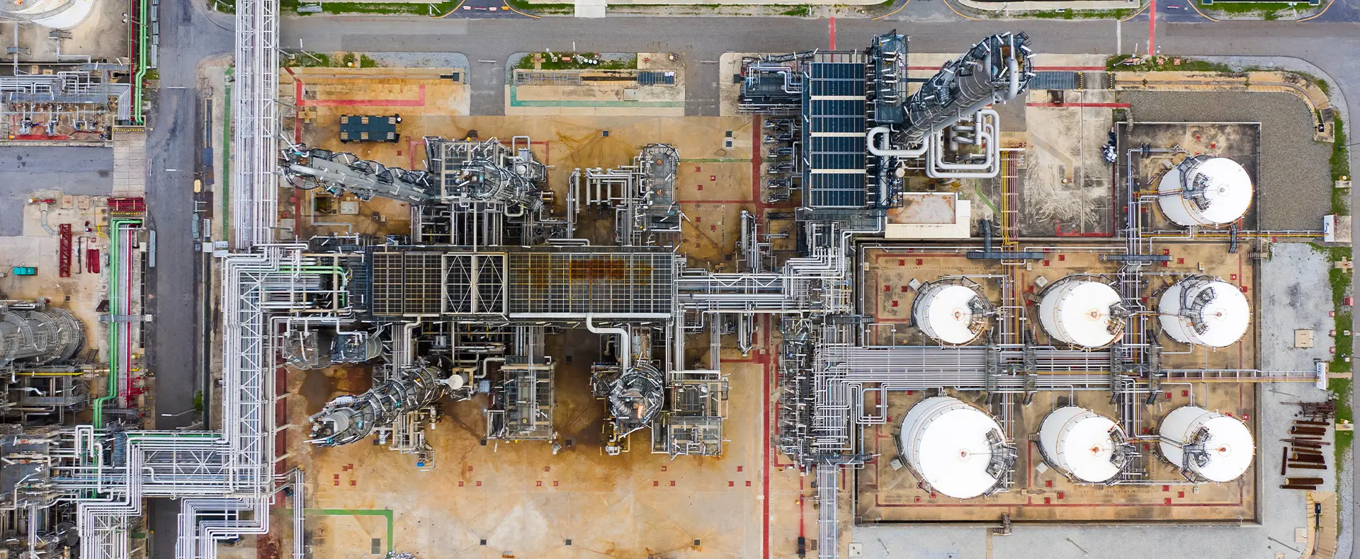 industrial processing infrastructure with multiple cylindrical storage tanks