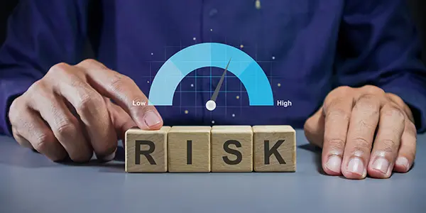 A professional assessing project risks with a meter indicating medium level