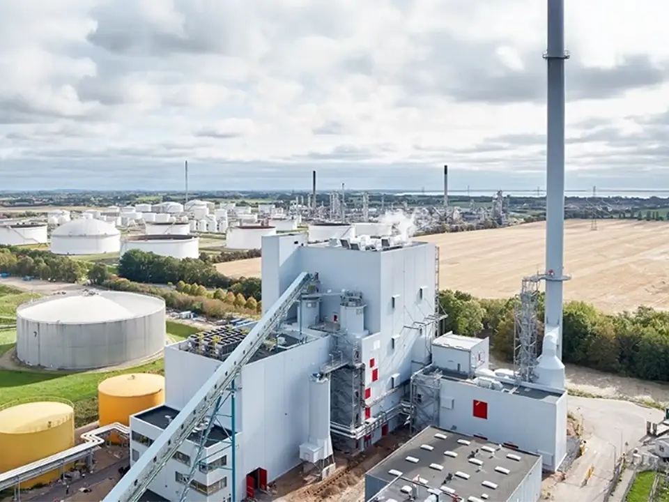 Industrial facility with large storage tanks located in open farmland