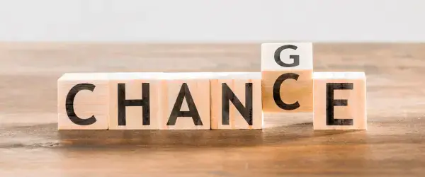 The word "change" is transforming into "chance", symbolizing effective change control in project management.