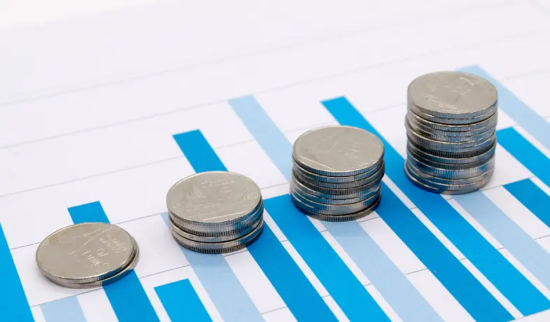 Coins on graphs representing lifecycle cost analysis (LCCA).